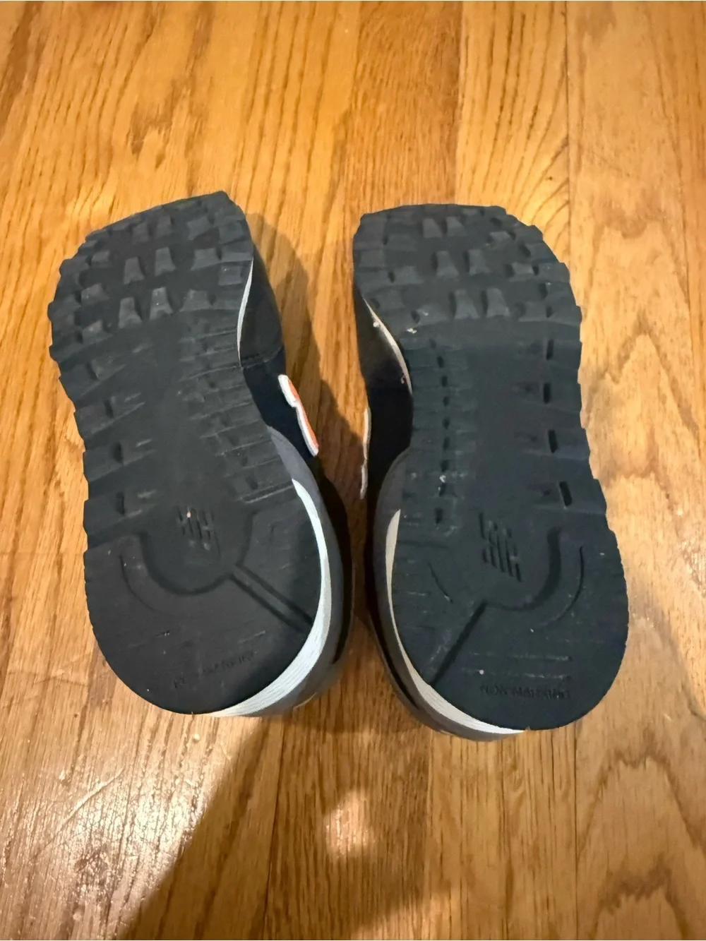 New Balance Kids Black and Orange Low-Top Sneakers